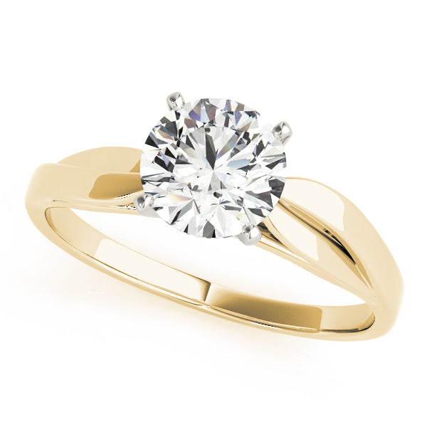 Angled front shot of round brilliant cut lab grown diamond solitaire engagement ring with twisted bypass band in yellow gold