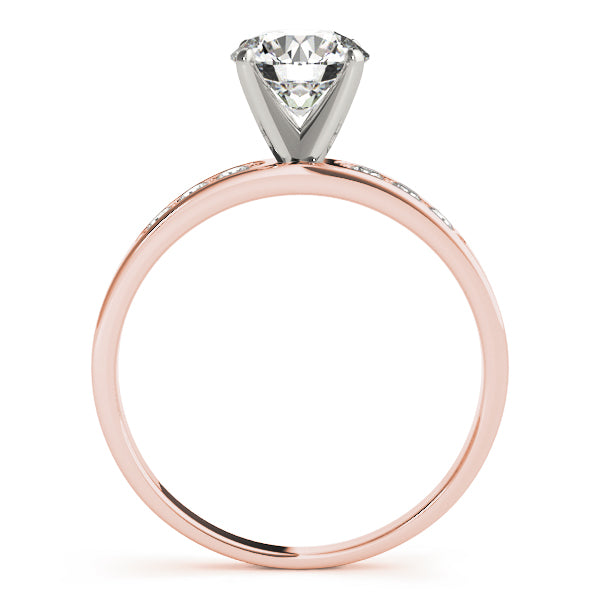 showing the secure four-prong setting elevating the round center diamond.
