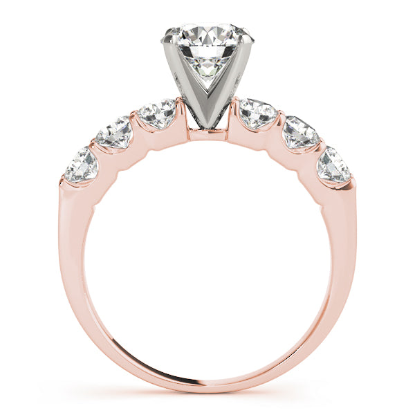 Side view of rose gold shared prong accent engagement ring.