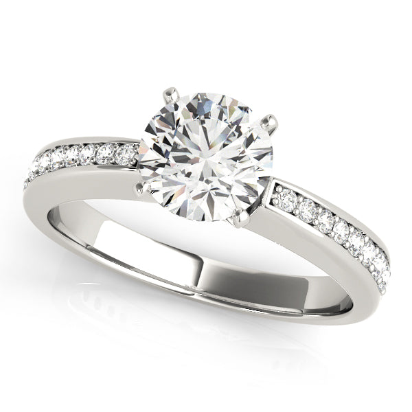 Angled top view of white gold round diamond ring.