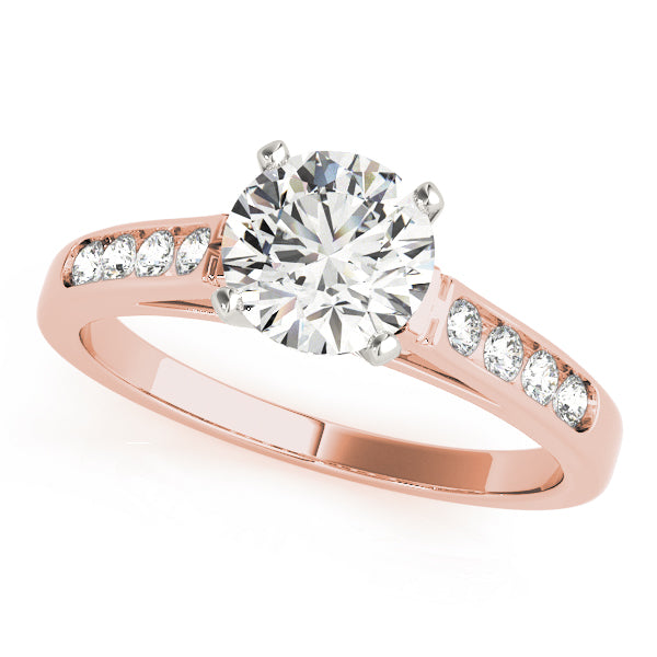 Angled display of a romantic 14k rose gold ring