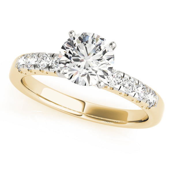 Three-quarter view of a round diamond ring with yellow gold scalloped pavé band