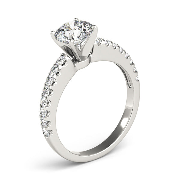 Showcase of white gold round diamond accent ring from a high perspective.