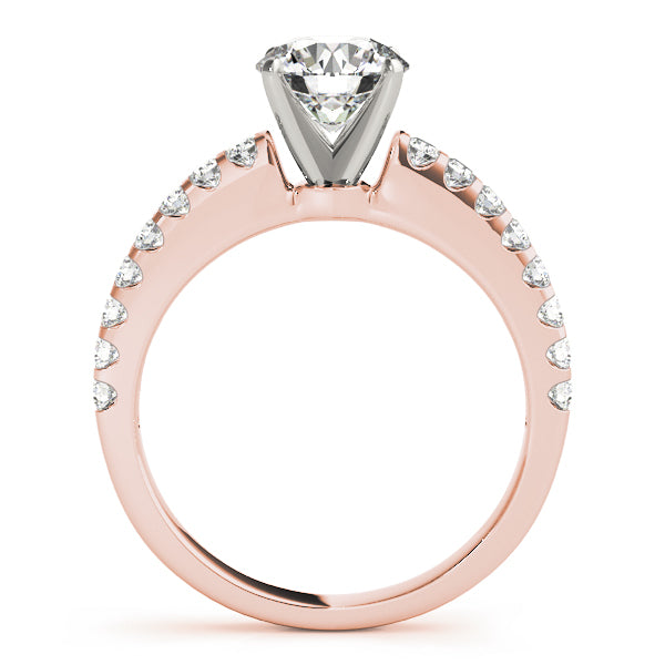Side silhouette of rose gold round diamond ring with tapering pave band.