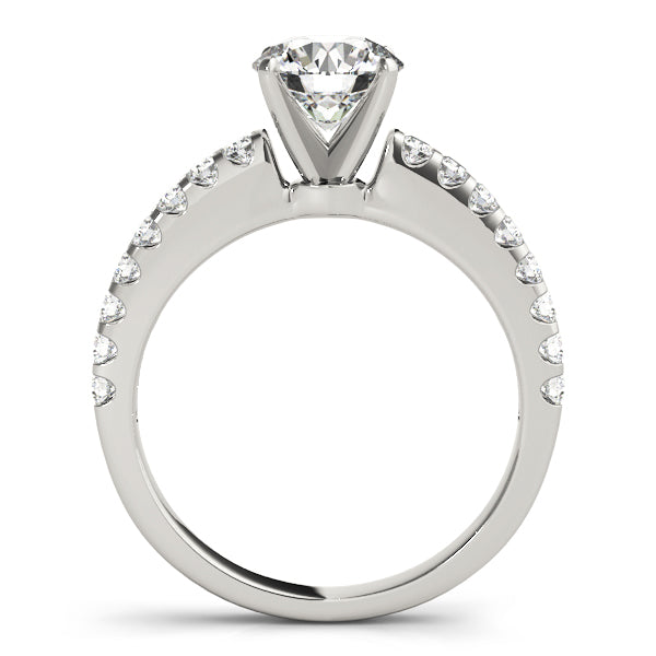 Profile view of white gold four-prong round solitaire ring with diamond accents.