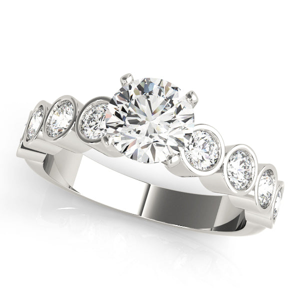 White gold solitaire diamond engagement ring with bezel band.