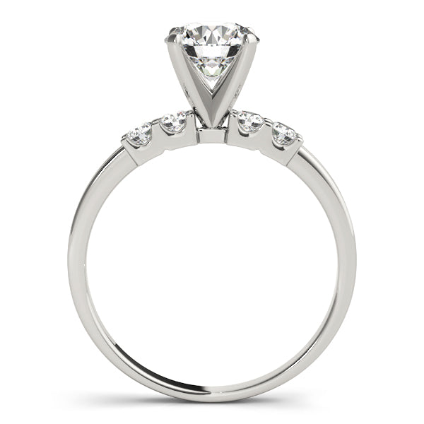 Side perspective of white gold prong accent diamond ring.
