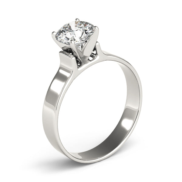 Elegant 14K white gold flat wide band solitaire ring featuring a brilliant round cut diamond.