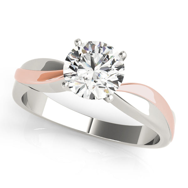 Overhead display of a 14K rose and white gold crossover shank round diamond solitaire ring.