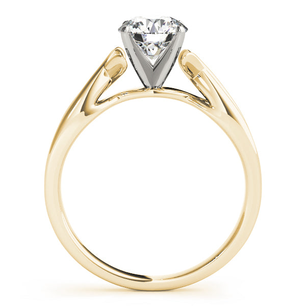 Angled shot of 14k yellow gold ribbon band ring highlighting the brilliant round cut diamond