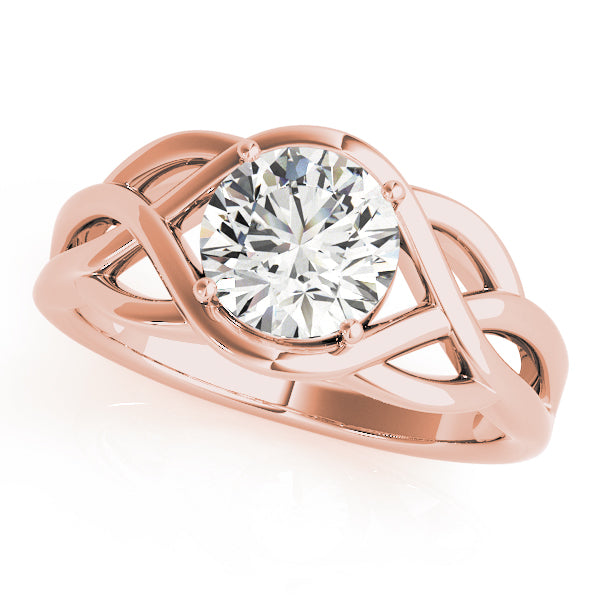 Angled shot of 14k rose gold twisted split shank round lab diamond ring.