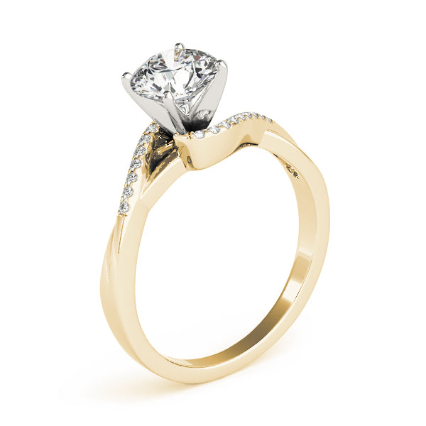 Side-tilted vertical view of a yellow gold bypass ring