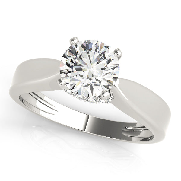 white gold round solitaire diamond ring showing a smooth, polished band.