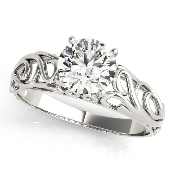 displaying fine filigree patterns and a brilliant round center stone.