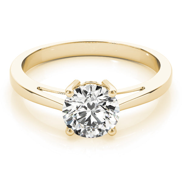 Top-down view of the round lab grown diamond on a luxurious yellow gold thick band
