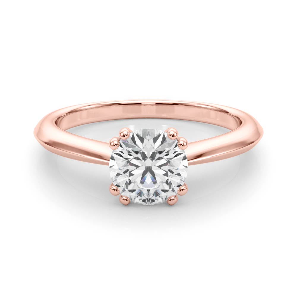 Elegant 14K rose gold ring with a VS F lab grown diamond secured by unique double prongs.