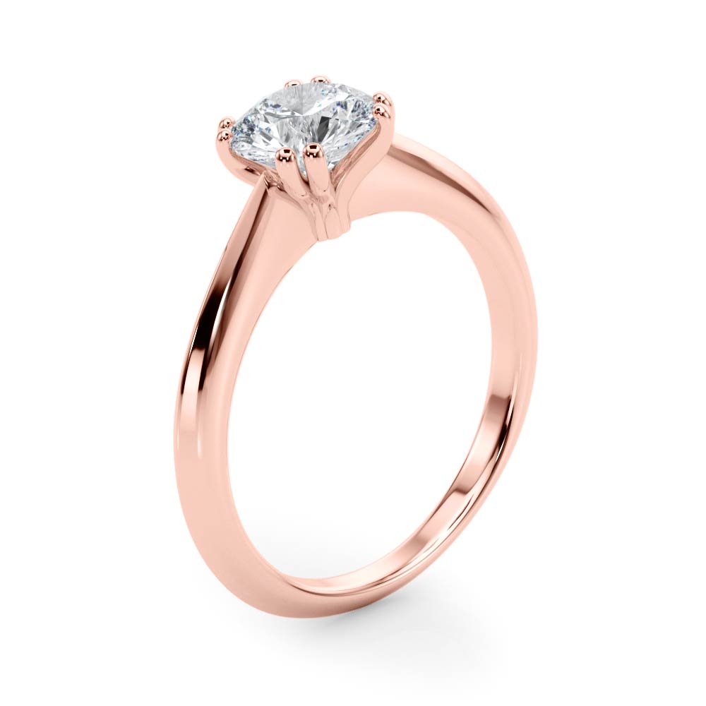 Detailed side angle of the rose gold ring showing the secure double prong grip.
