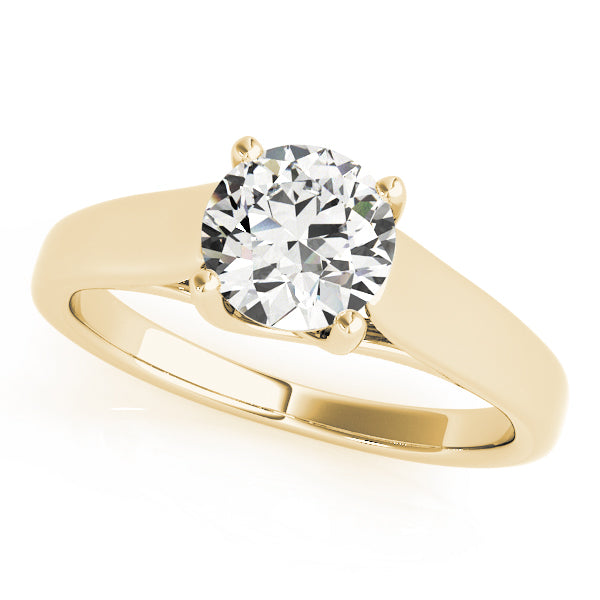 Round brilliant cut lab grown diamond set in a 14K yellow gold band with a sleek, tapering design