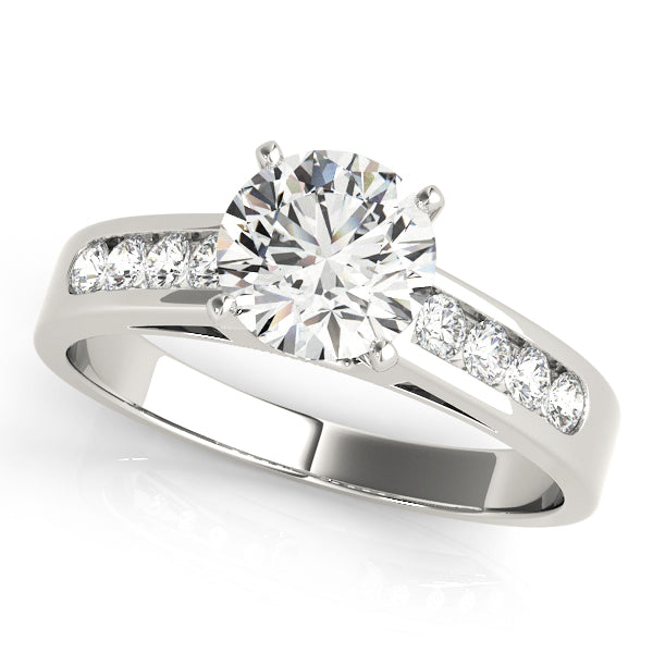 Classic round brilliant diamond solitaire ring with channel set side stones in white gold