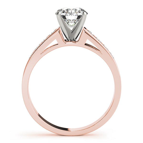 Elegant side view showing channel set diamonds on rose gold cathedral band