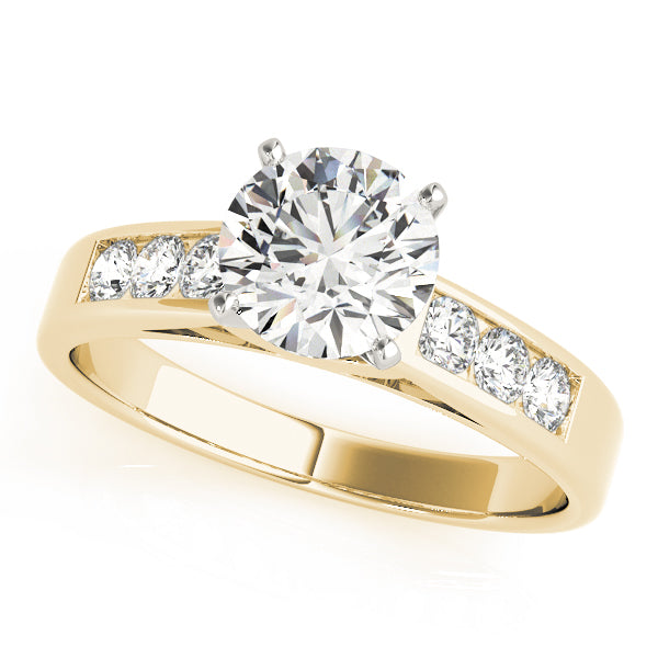Round cut diamond engagement ring with channel-set diamond band in 14K yellow gold, top view.