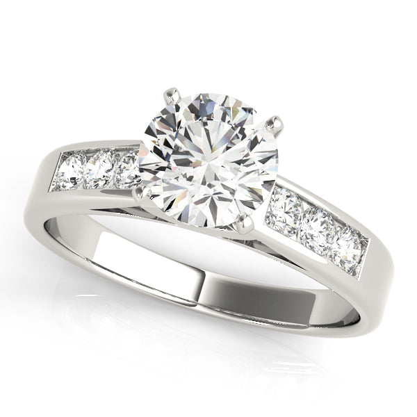 Classic round brilliant diamond ring featuring a channel-set band in white gold