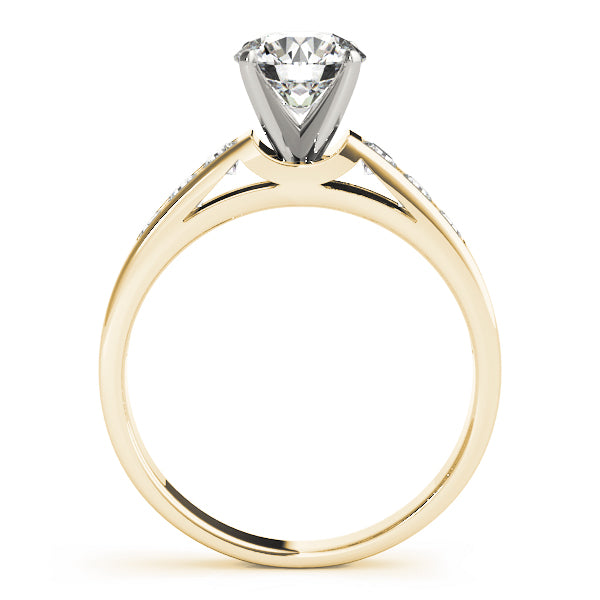 Side profile view of a yellow gold round diamond engagement ring showing the classic 4-prong setting