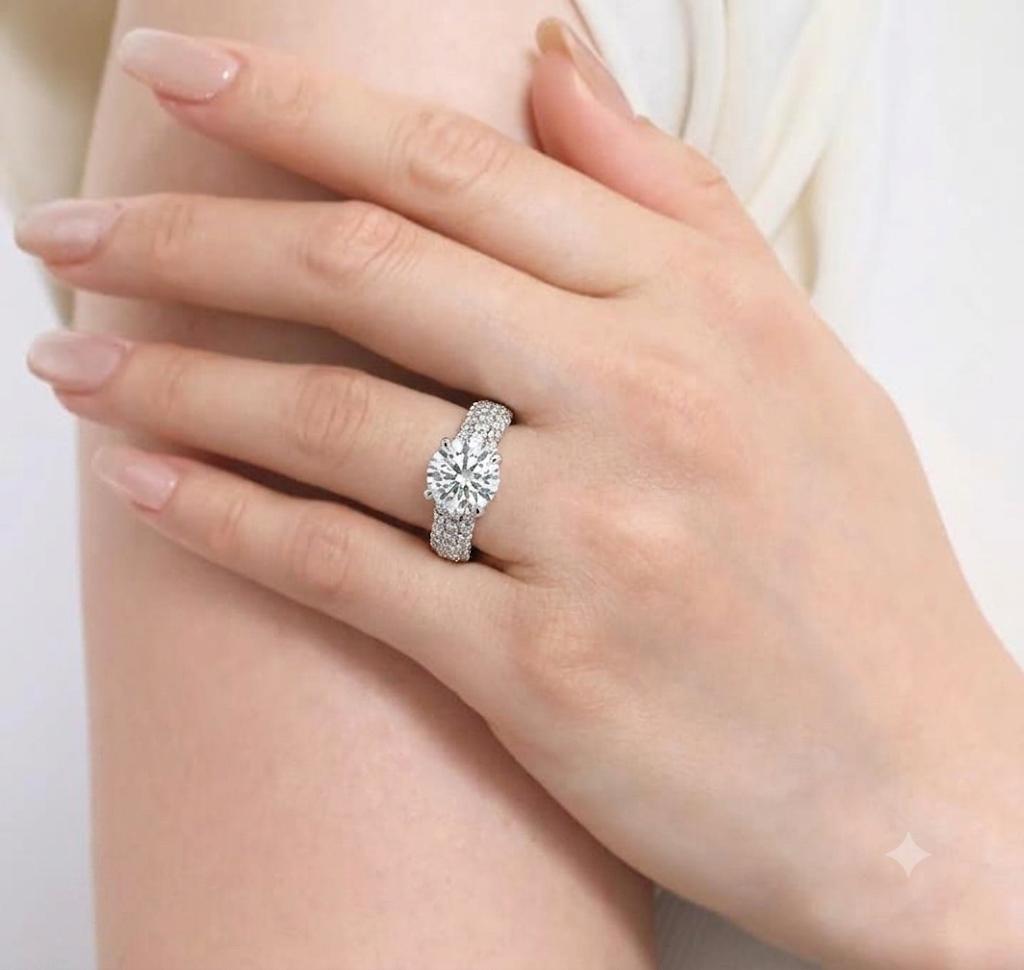 White gold multi-row pavé lab diamond ring on a woman's hand.