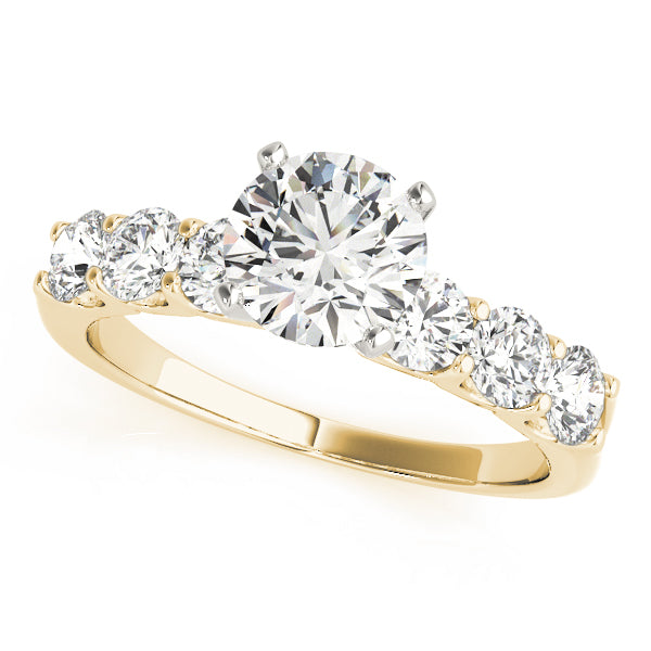 Yellow gold round lab diamond shared prong engagement ring.