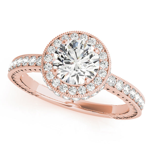 Rose gold round lab diamond halo engagement ring with engraved band.