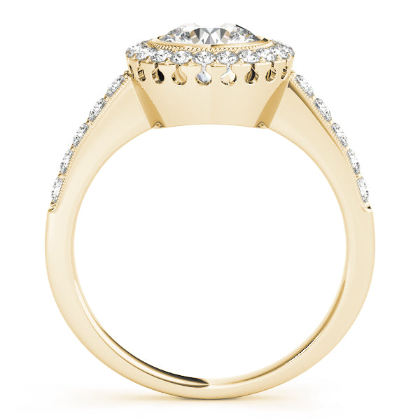 Direct side profile view of a yellow gold bezel halo engagement ring