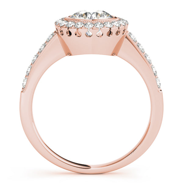 view of a rose gold round diamond halo ring displaying the secure bezel design