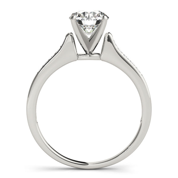 showcasing the high-polish finish and the alignment of the prong-set shoulder diamonds.