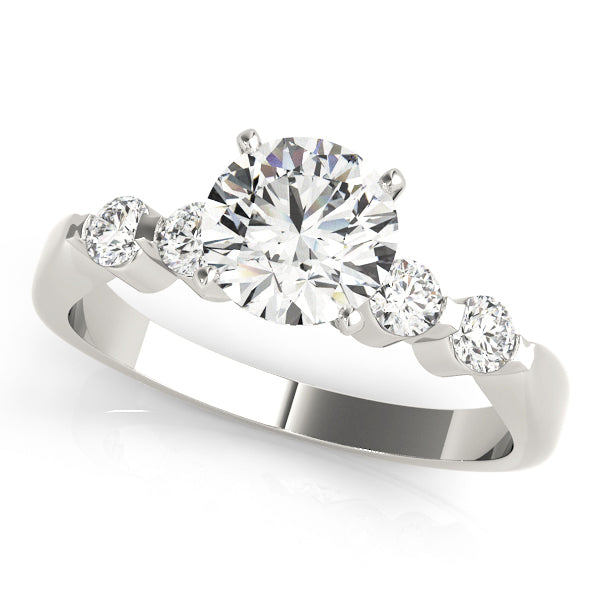 High-polished 14k white gold anniversary ring displaying a large round center diamond