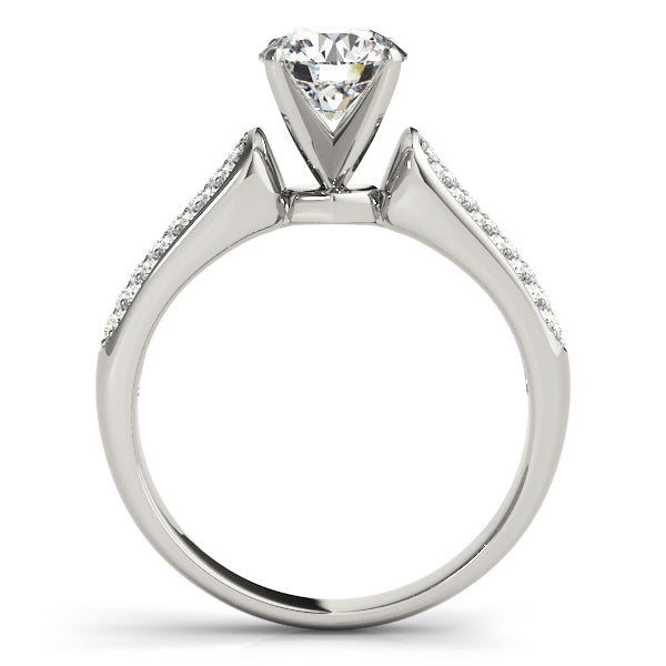 Clean side profile shot of a 14k white gold anniversary ring displaying the traditional four-prong