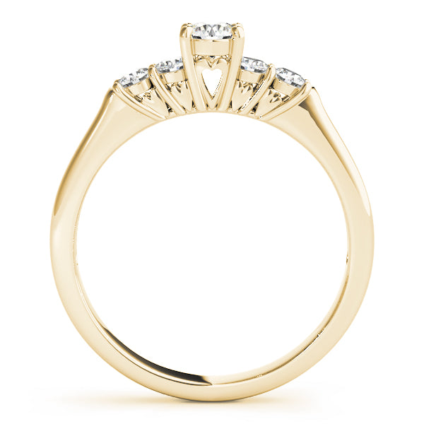 Side profile view of a 14k yellow gold diamond ring revealing hidden heart-shaped cutouts
