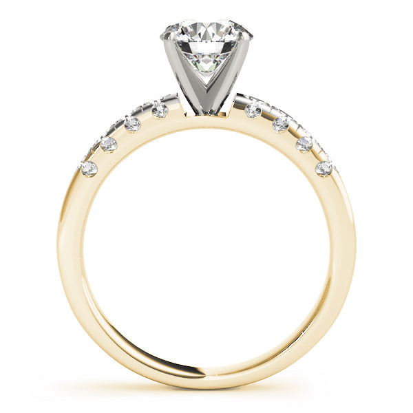 Side profile of a yellow gold engagement ring with high four-prong head