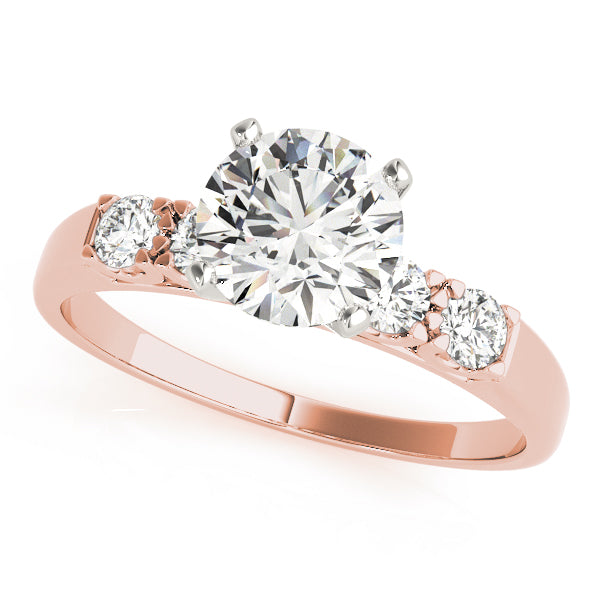 Angled photo of a rose gold cathedral ring with shared prong diamonds