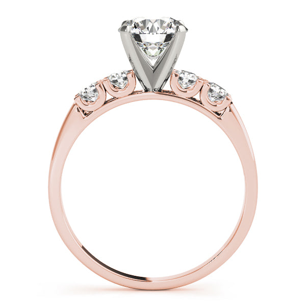Side silhouette of a rose gold high-set cathedral ring with open prongs