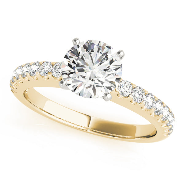 Top angled view of round diamond French-cut pave ring in yellow gold.