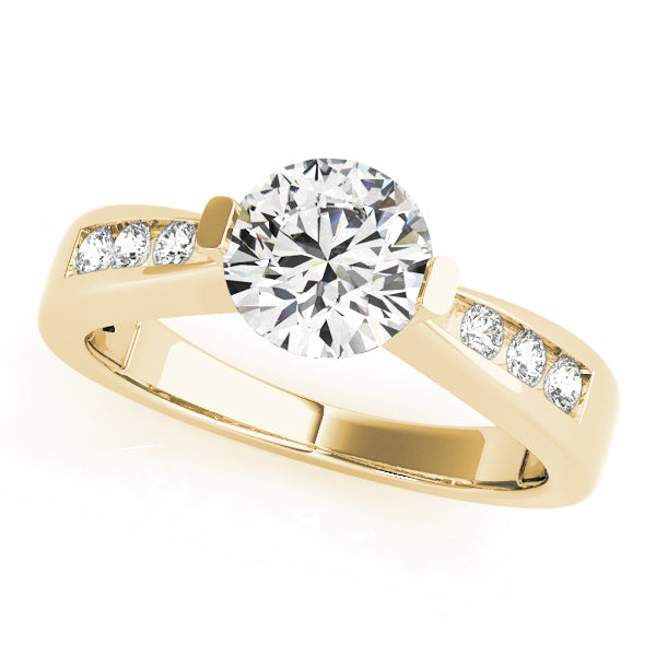 Top angled view of round lab grown diamond channel-set tapering ring in 14K yellow gold.