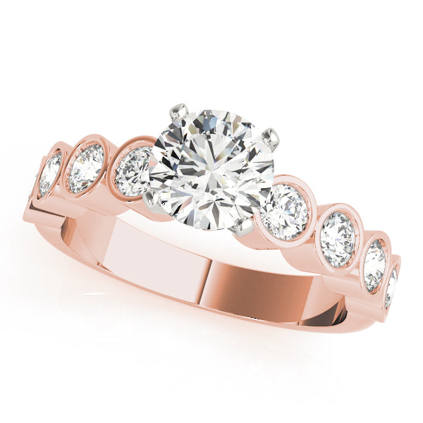 Rose gold round cut diamond ring featuring bezel set accents.