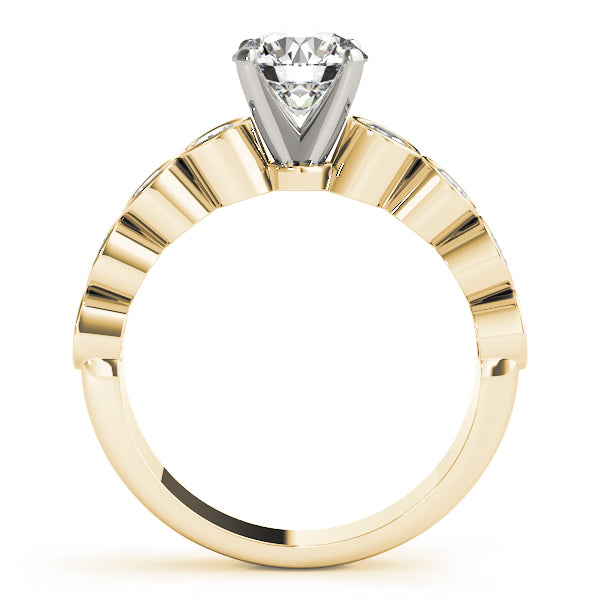 Side profile of yellow gold ring showing prong and bezel details.