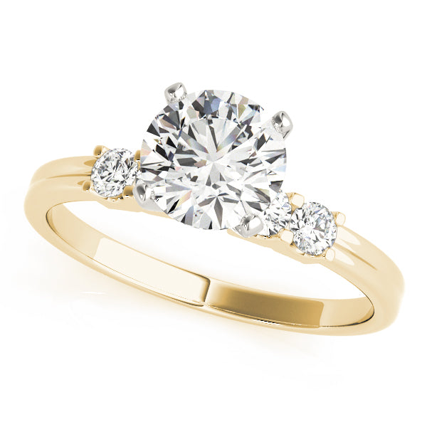 Yellow gold round lab diamond prong ring with side diamonds.