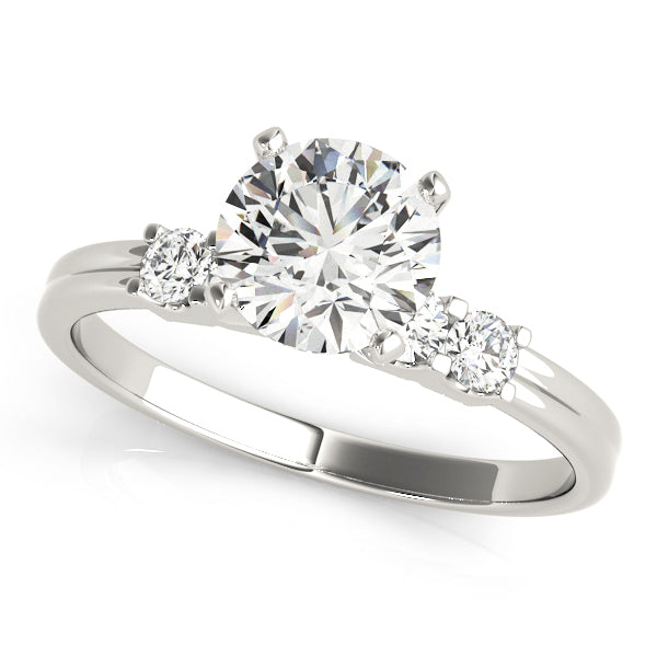 White gold solitaire diamond ring featuring prong set side stones.
