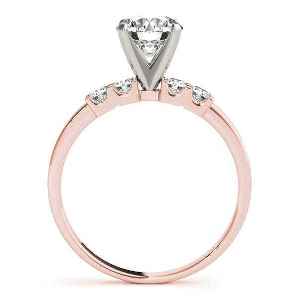 Side view of rose gold round diamond ring with elevated prongs.