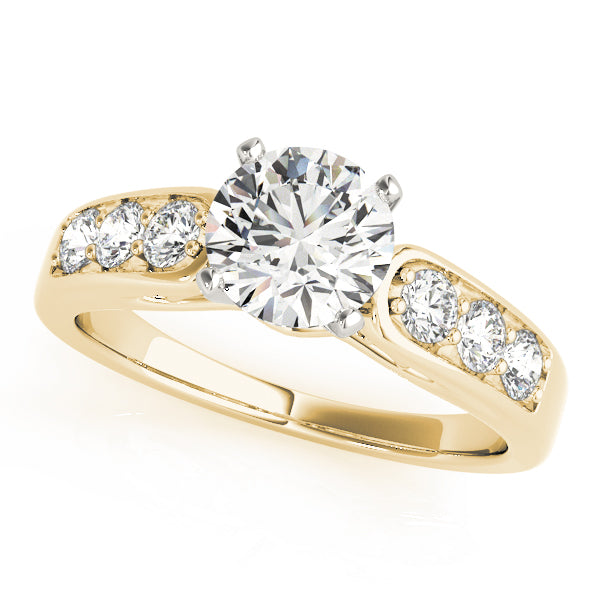 Yellow gold round lab diamond ring with prong set side stones.