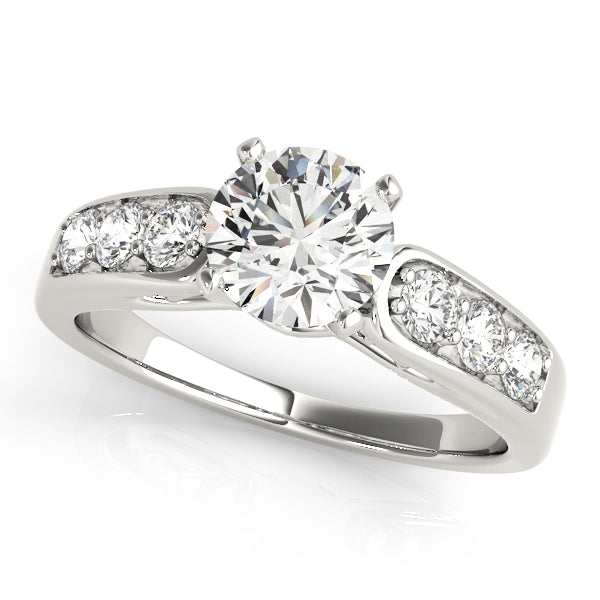 White gold solitaire diamond ring with smooth prong side diamonds.