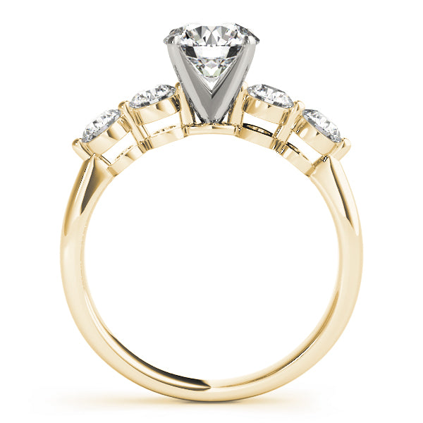 Side profile view of 14K yellow gold five stone lab diamond ring showing arched setting