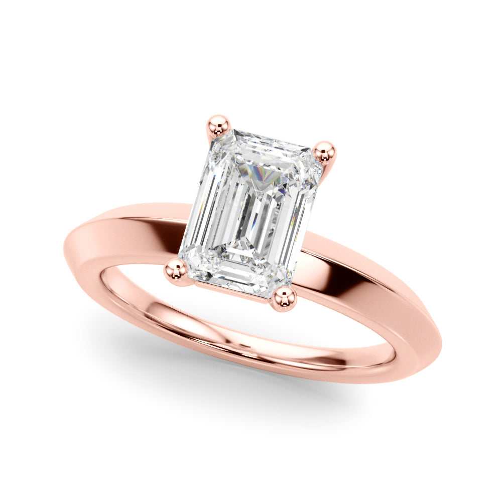 Stunning angled shot of rose gold knife edge engagement ring showcasing a crisp emerald cut diamond